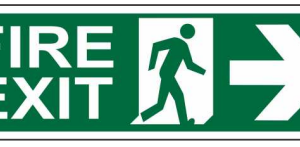 Green FIRE EXIT sign with a running-person symbol and right-pointing arrow by Safe Cure