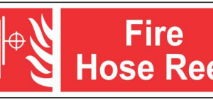 Red FIRE HOSE REEL sign with a white fire-hose pictogram by Safe Cure