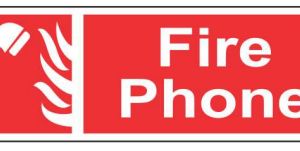 Red FIRE PHONE sign with a white telephone-handset pictogram by Safe Cure